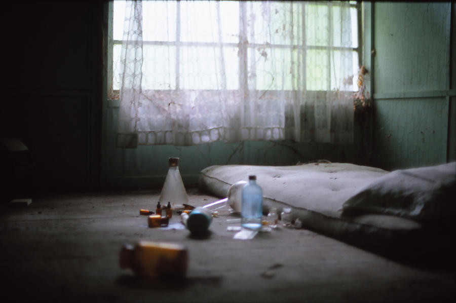 Bottles and bed in old room Photograph by By CaDs