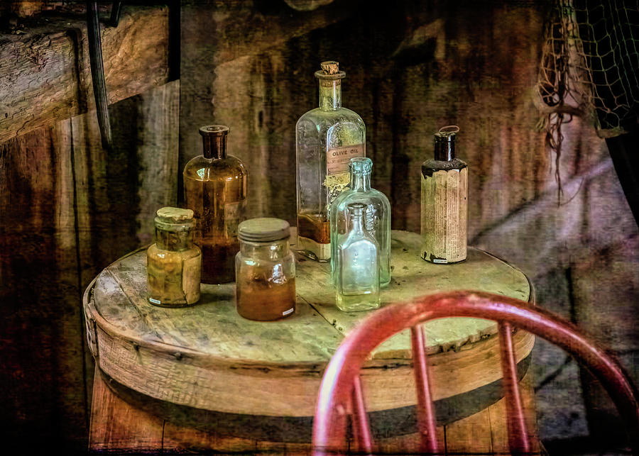 Bottles On A Barrel Photograph