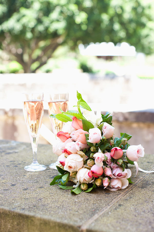 Bouquet and champagne Photograph by Paul Bradbury