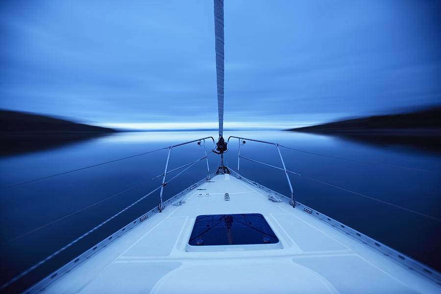 Bow of boat sailing on lake Photograph by Adam Gault