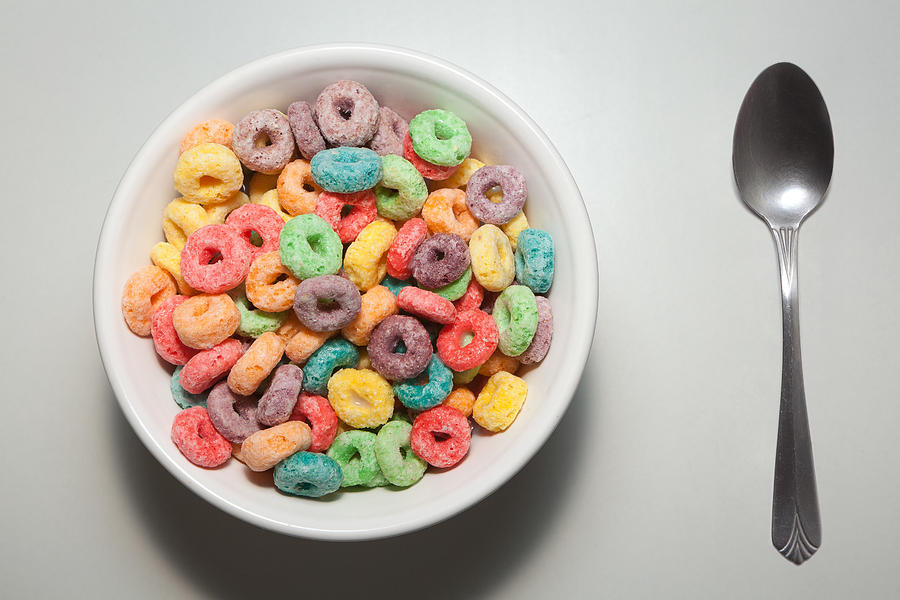 Bowl of colorful breakfast cereal with spoon Photograph by Andre Rivas