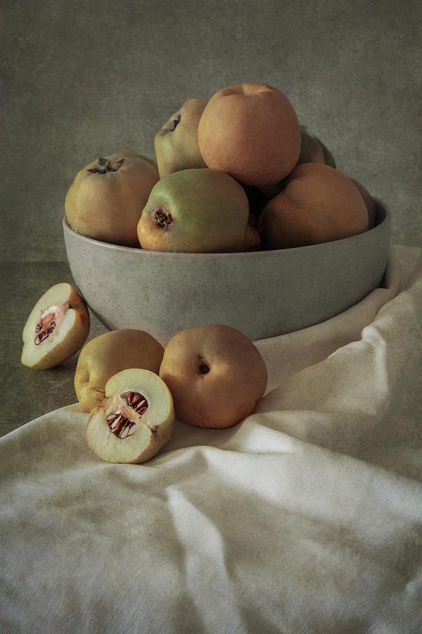 Bowl of fresh quinces Photograph by Jaroslaw Blaminsky