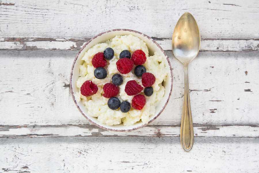 Bowl of Rice Pudding with Berries Photograph by Larissa Veronesi