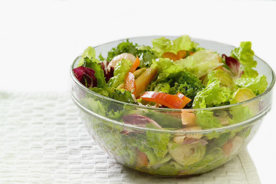 Bowl of salad with shrimp and vegetables sitting on a paper towel, close-up, part of Photograph by Medioimages/Photodisc