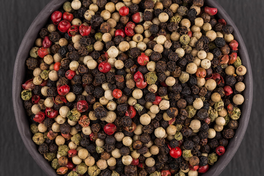 Bowl Of Various Pepper Peppercorns Seeds Mix On Dark Stone Photograph by R.Tsubin Bowl Of Various Pepper Peppercorns Seeds Mix On Dark Stone Photograph by R.Tsubin