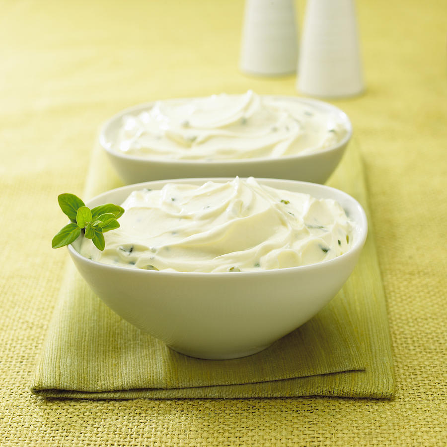 Bowls of soft curd cheese Photograph by Jupiterimages