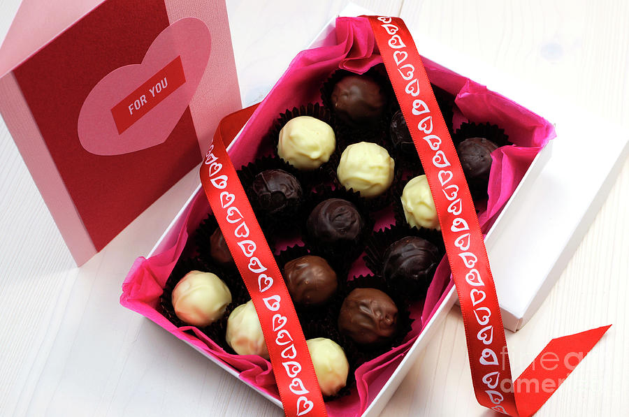 Box of chocolates with red heart ribbon and pink and red handmad Photograph by Milleflore Images