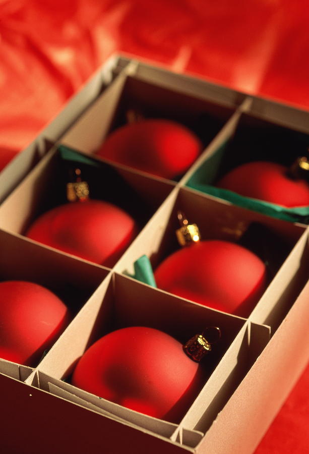 Box of Christmas decorations (baubles), close-up Photograph by Andreas Pollok