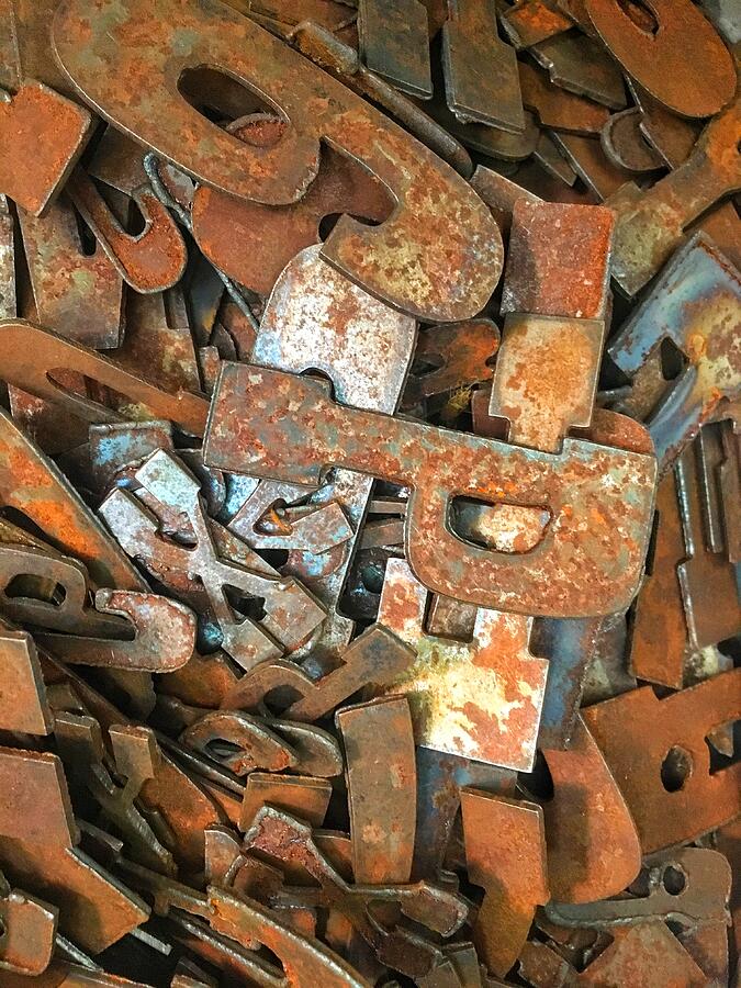 Box of Rusty Metal Numbers and Letters Photograph by Jerry Abbott