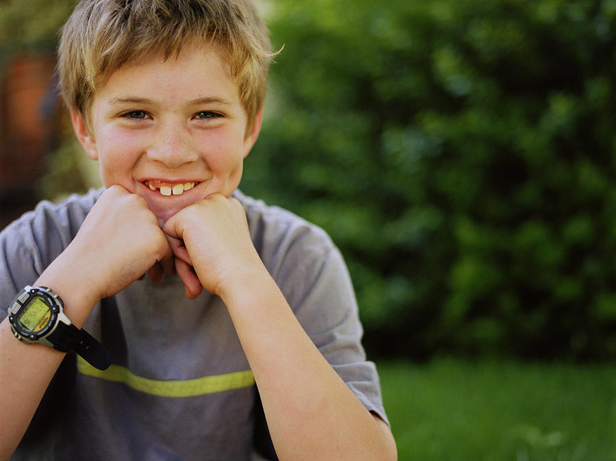 Boy (10-12) smiling, portrait Photograph by Sean Justice