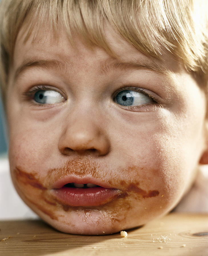 Boy (2-4) with food around mouth, close-up Photograph by Rjw