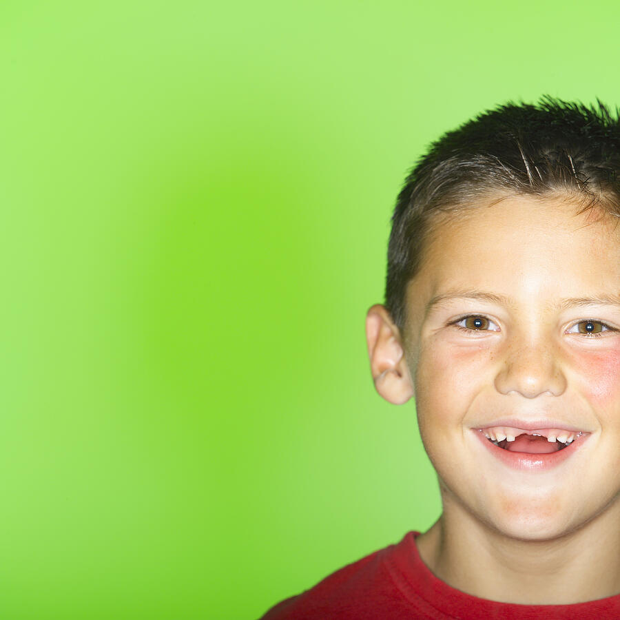 Boy (6-8) with missing front teeth, smiling, portrait Photograph by SW Productions