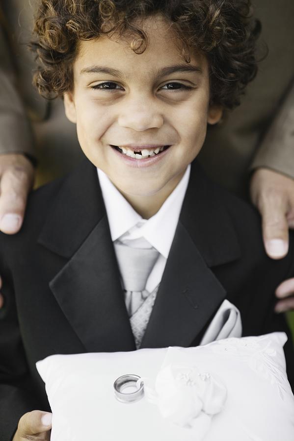 Boy as ring bearer at wedding Photograph by Ned Frisk