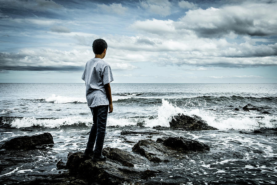 Boy at the edge of the sea Photograph by Francisco Ruiz Navas