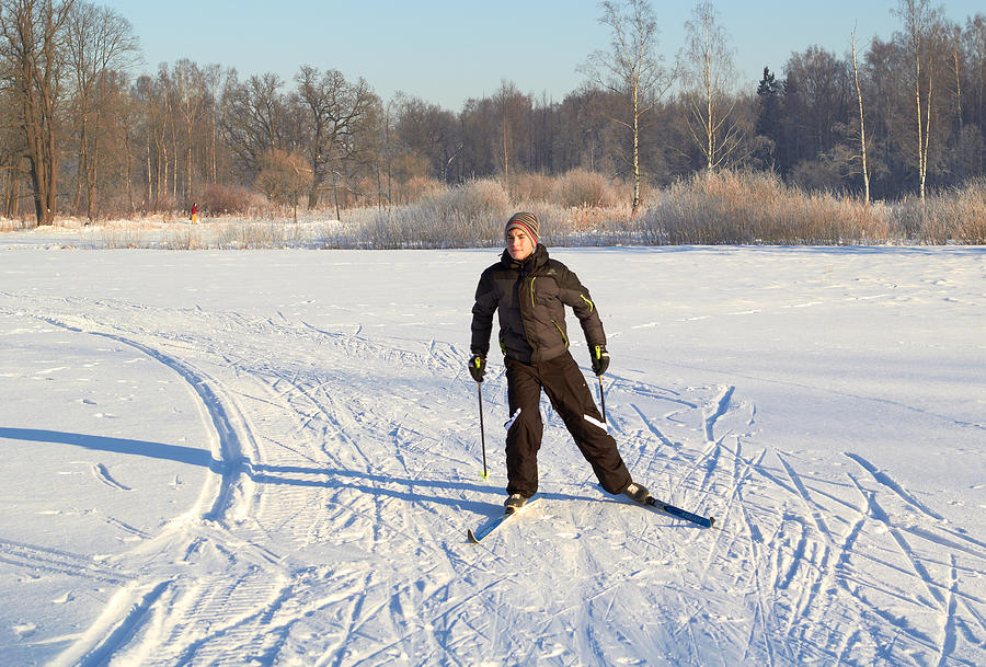 Boy cross country skiing at sunny winter day Photograph by Micheyk