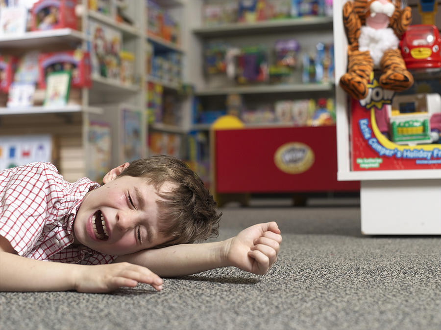 Boy Crying in Toy Store Photograph by Sean Justice