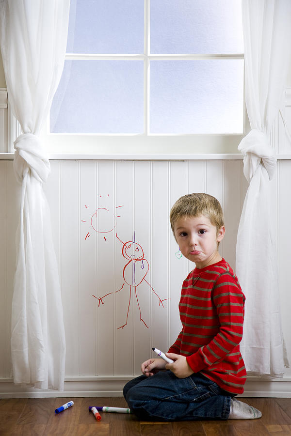 Boy Drawing On The Wall Photograph by RubberBall Productions