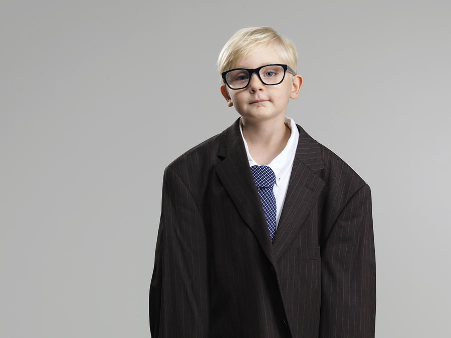 Boy dressed in mans suit Photograph by Zing Images
