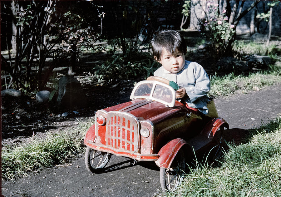 Boy Driving Toy Tin Car 1950s Japan Vintage Japan Daily Life Japanese by Timeless Images Archive