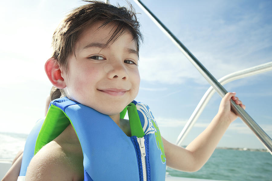 Boy enjoying a boat ride Photograph by Chaos