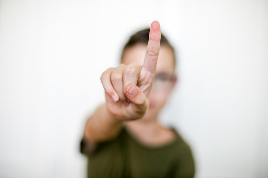 boy hand with index finger.Selective focus Photograph by Carol Yepes