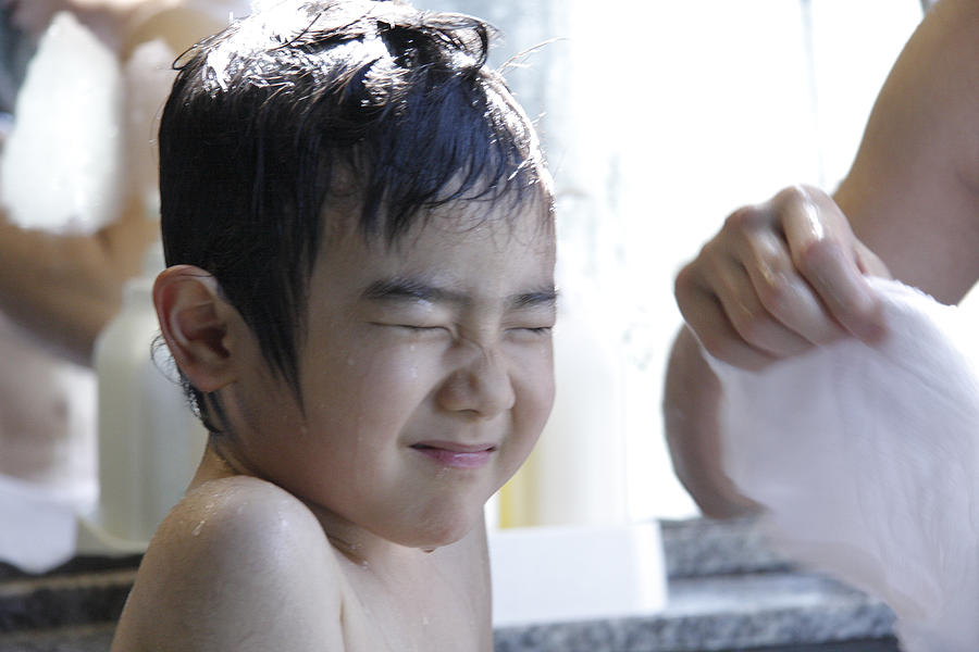 Boy having his hair shampooed Photograph by Tagstock1