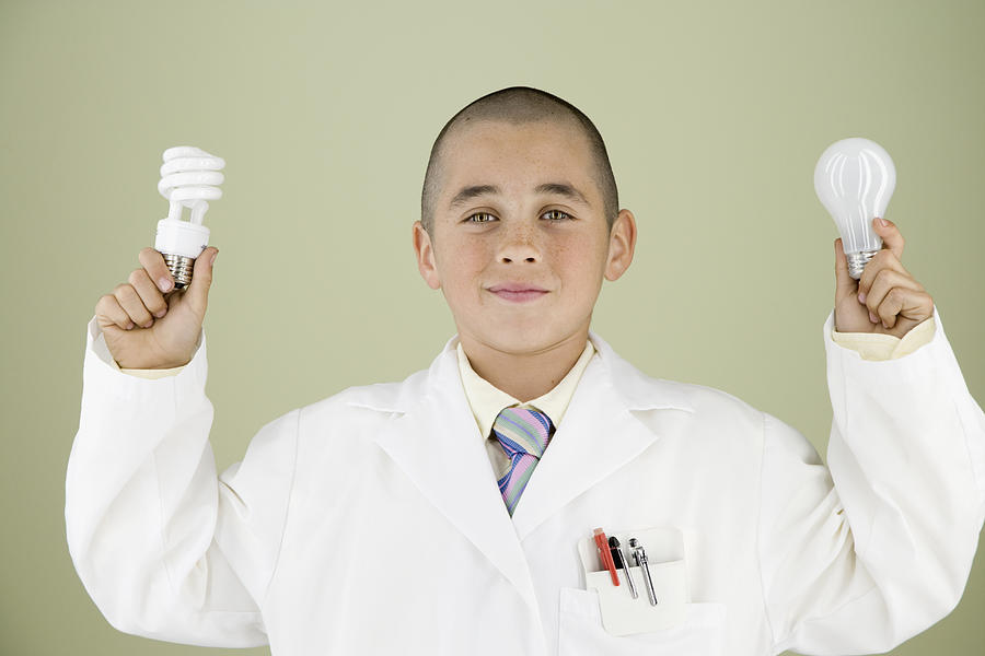 Boy holding light bulbs Photograph by Hill Street Studios