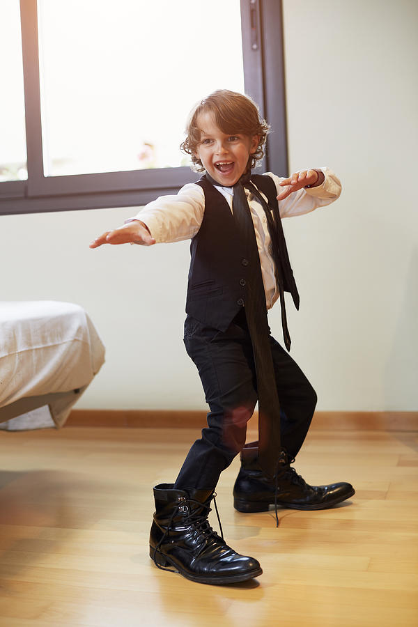Boy in formal wear posing at home Photograph by Morsa Images