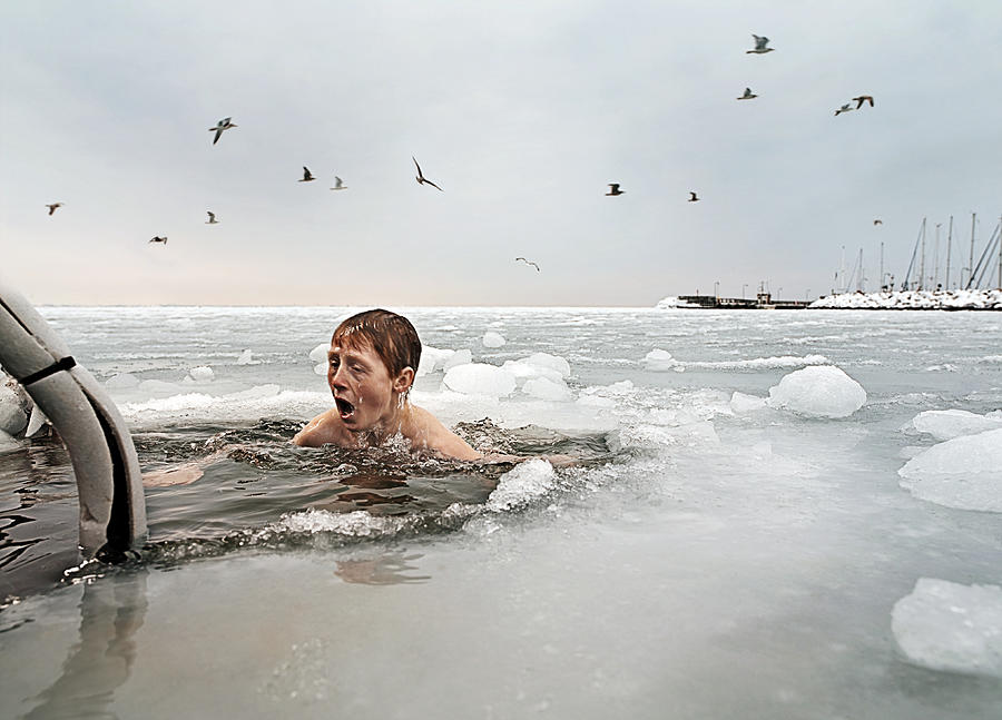 Boy in frozen sea. Photograph by David Trood