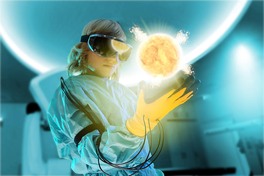 Boy in virtual reality headset interacting with digital floating sun Photograph by KaPe Schmidt