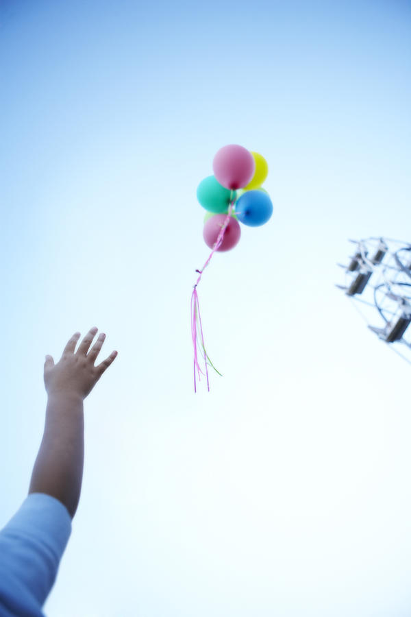 Boy Letting Go Of Balloons  Photograph by Thomas Northcut