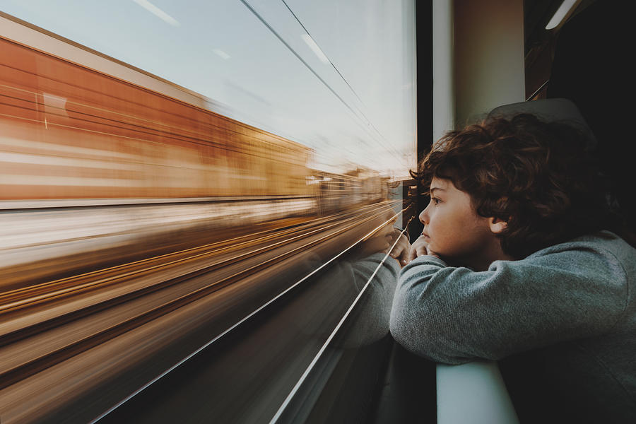 Boy Looking Through Train Window Photograph by Silviomedeiros