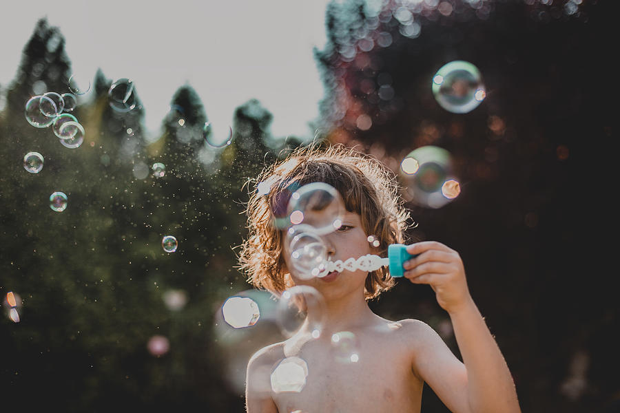 Boy  Making Bubbles Outdoor Photograph by Carol Yepes