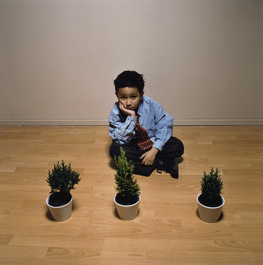 Boy near Row of Plants Photograph by Betsie Van Der Meer