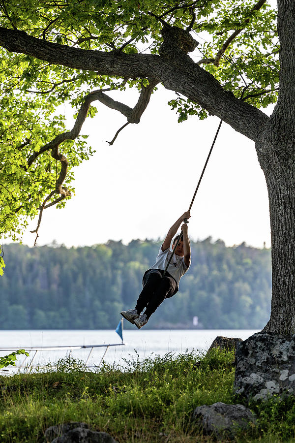 Boy on swing Photograph by Alexander Farnsworth