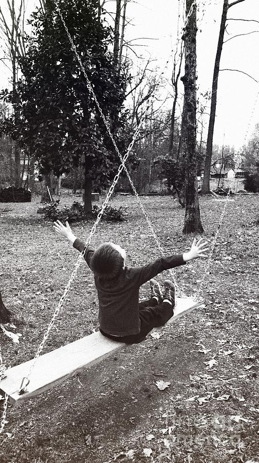 Suspended Joy A Boys Delightful Flight On The Swing Photograph