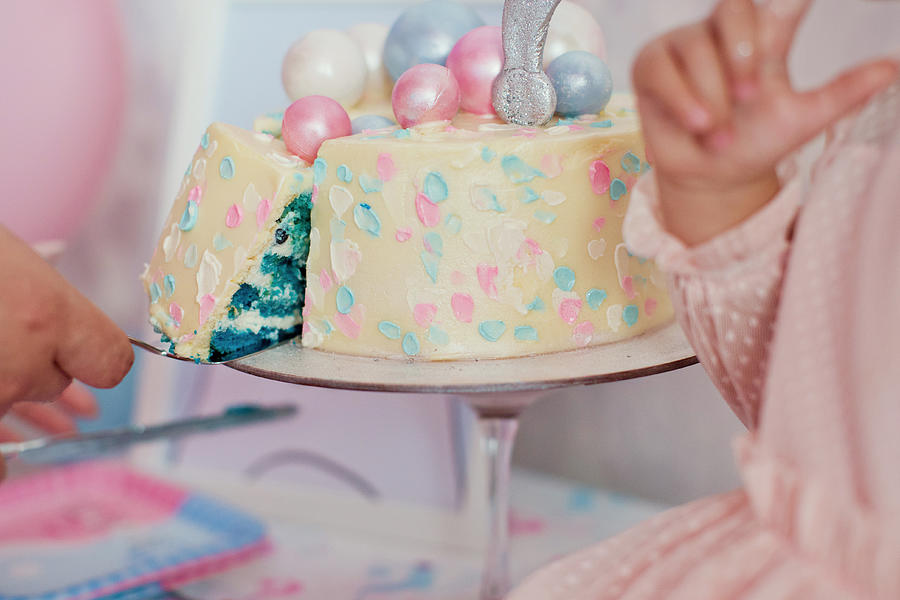 Boy or girl cake and different treats for gender reveal party Photograph by Oksana_nazarchuk