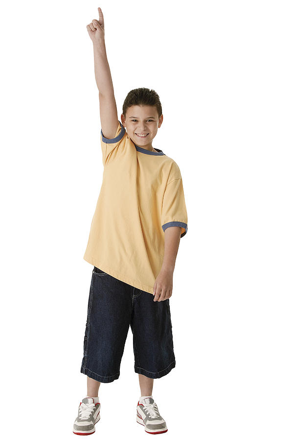 Boy pointing up Photograph by Comstock Images