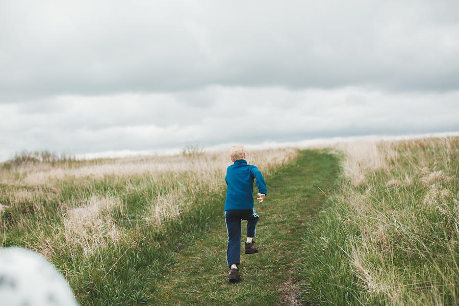 Boy running away Photograph by Annie Otzen