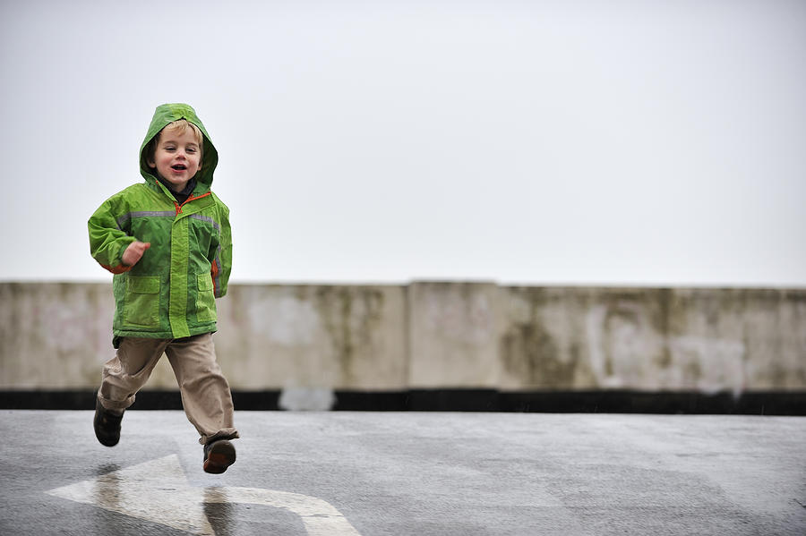 Boy running Photograph by Daisy Hutchinson