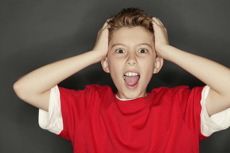 Boy screaming Photograph by Comstock Images
