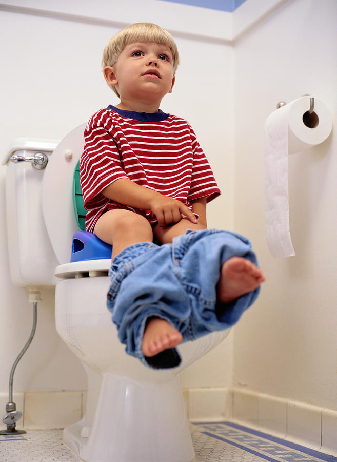 Boy Sitting on a Potty Chair Photograph by Ryan McVay