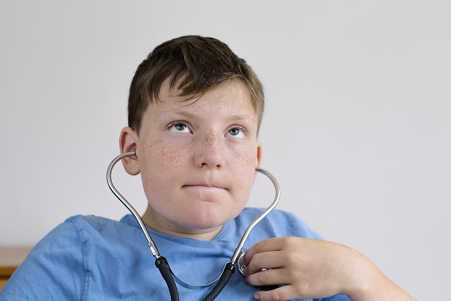 Boy using a stethoscope Photograph by Gombert, Sigrid/science Photo Library