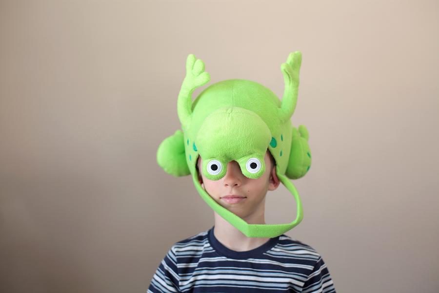Boy wearing a frog basket hat Photograph by Jessica Harms