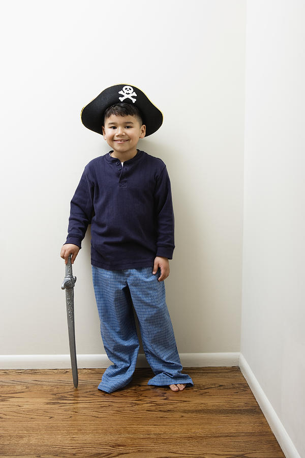 Boy wearing pirate hat Photograph by Colorblind Images LLC