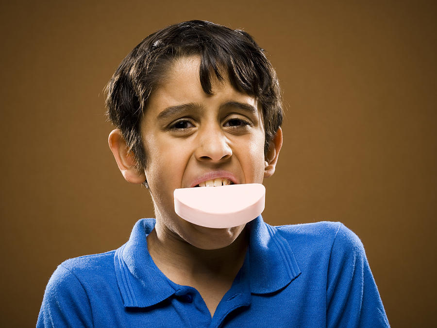 Boy with bar of soap in mouth Photograph by Rubberball/Mike Kemp