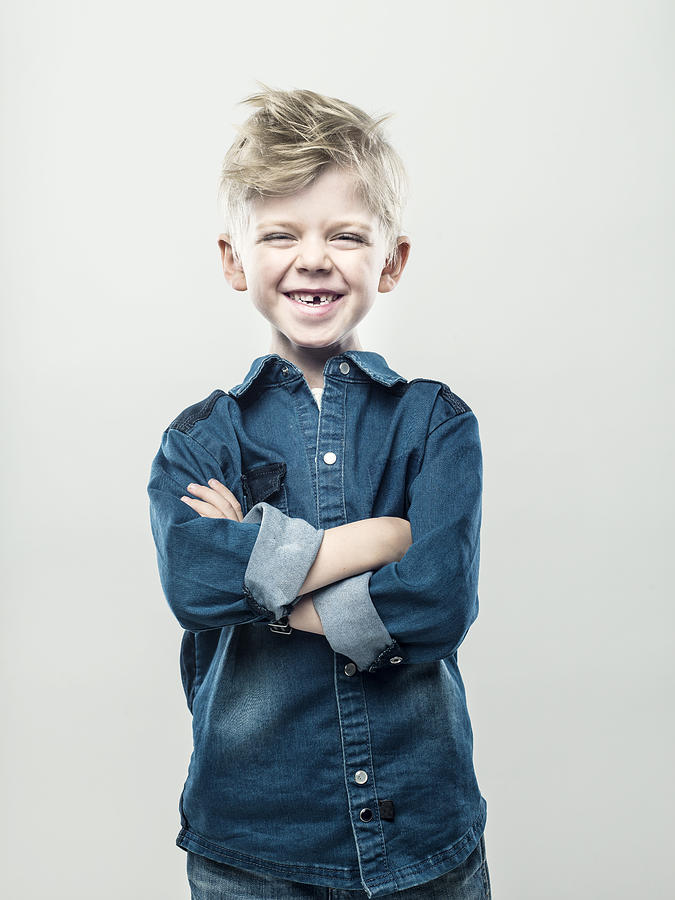 Boy with crossed arms Photograph by Johner Images