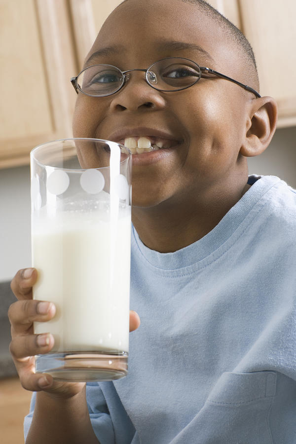 Boy with Large Glass of Milk Photograph by PictureNet