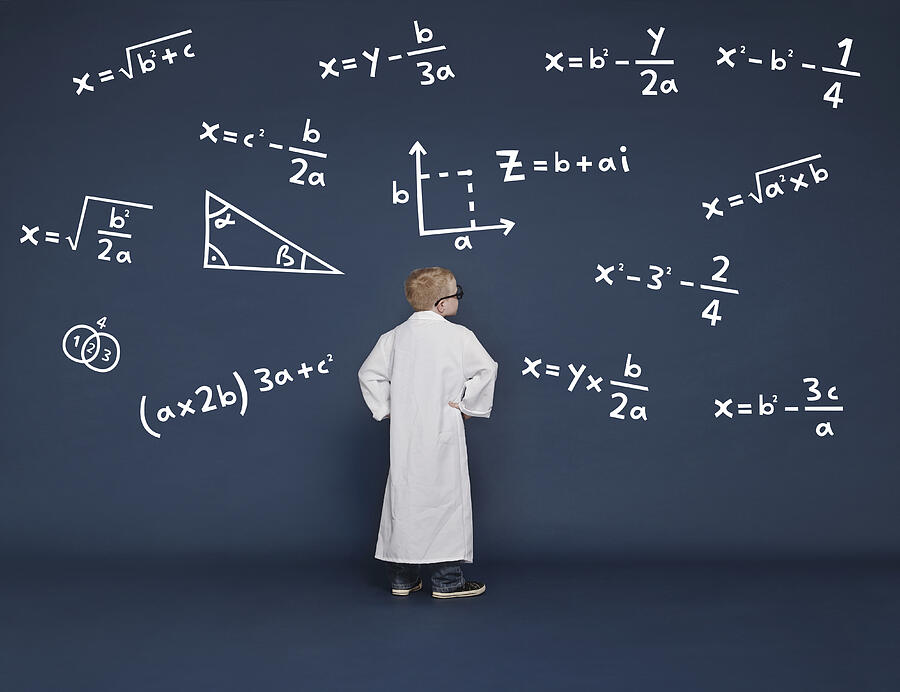 Boy with mathematical equations Photograph by Flashpop