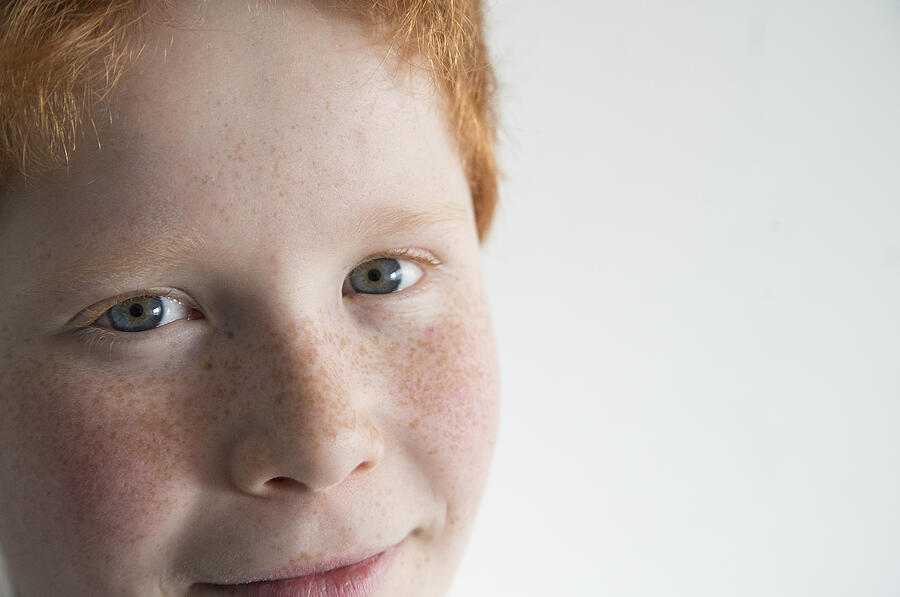 Boy with red hair and freckles, close-up portrait Photograph by PhotoAlto/Frederic Cirou